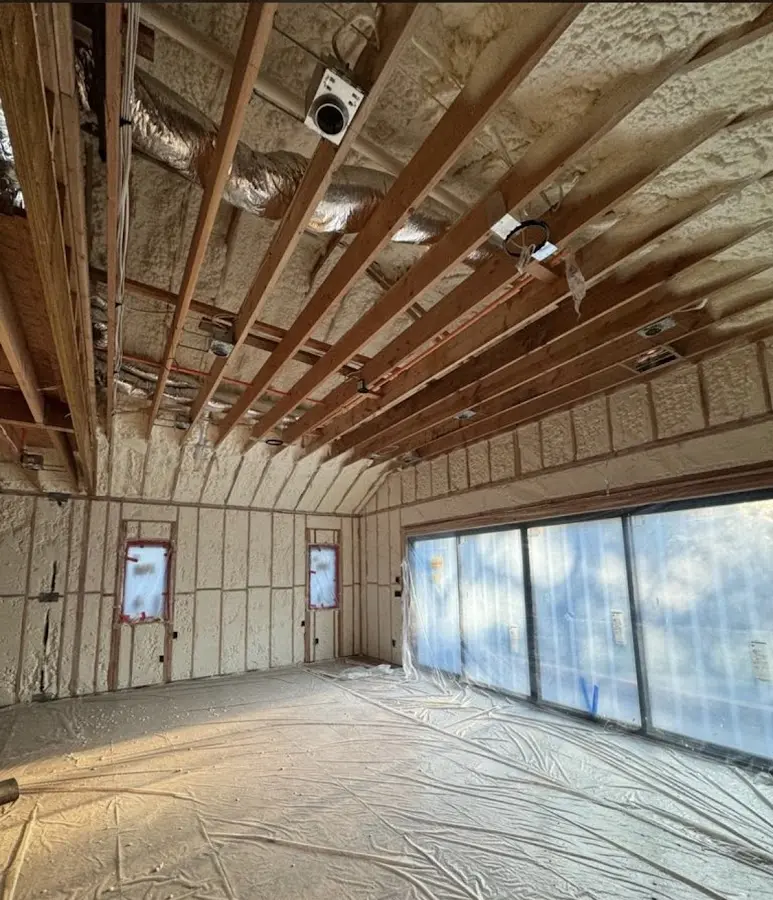 Interior walls and ceiling insulated with spray foam during new construction in Hudsonville